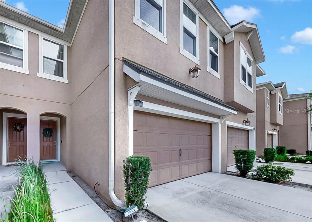 10212 Newel Valley Loop Riverview, FL 33569 - Photo 3 of 72 a front view of a building with a yard