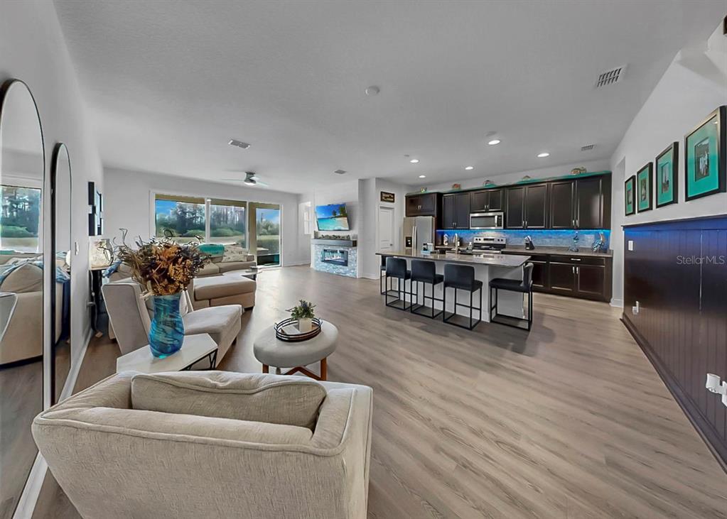 10212 Newel Valley Loop Riverview, FL 33569 - Photo 31 of 72 a living room with furniture and a wooden floor