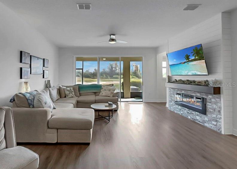 10212 Newel Valley Loop Riverview, FL 33569 - Photo 41 of 72 a living room with fireplace furniture and a flat screen tv