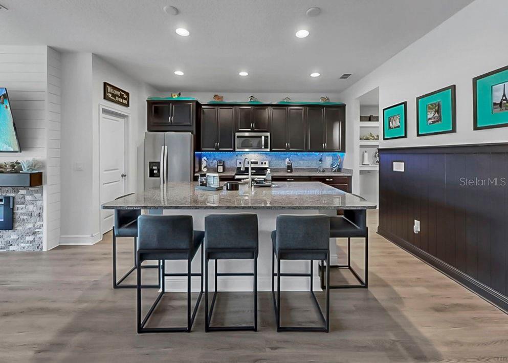 10212 Newel Valley Loop Riverview, FL 33569 - Photo 44 of 72 a kitchen with a table and chairs in it