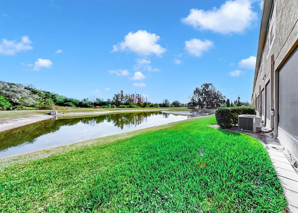10212 Newel Valley Loop Riverview, FL 33569 - Photo 8 of 72 a view of a lake with a garden in the background