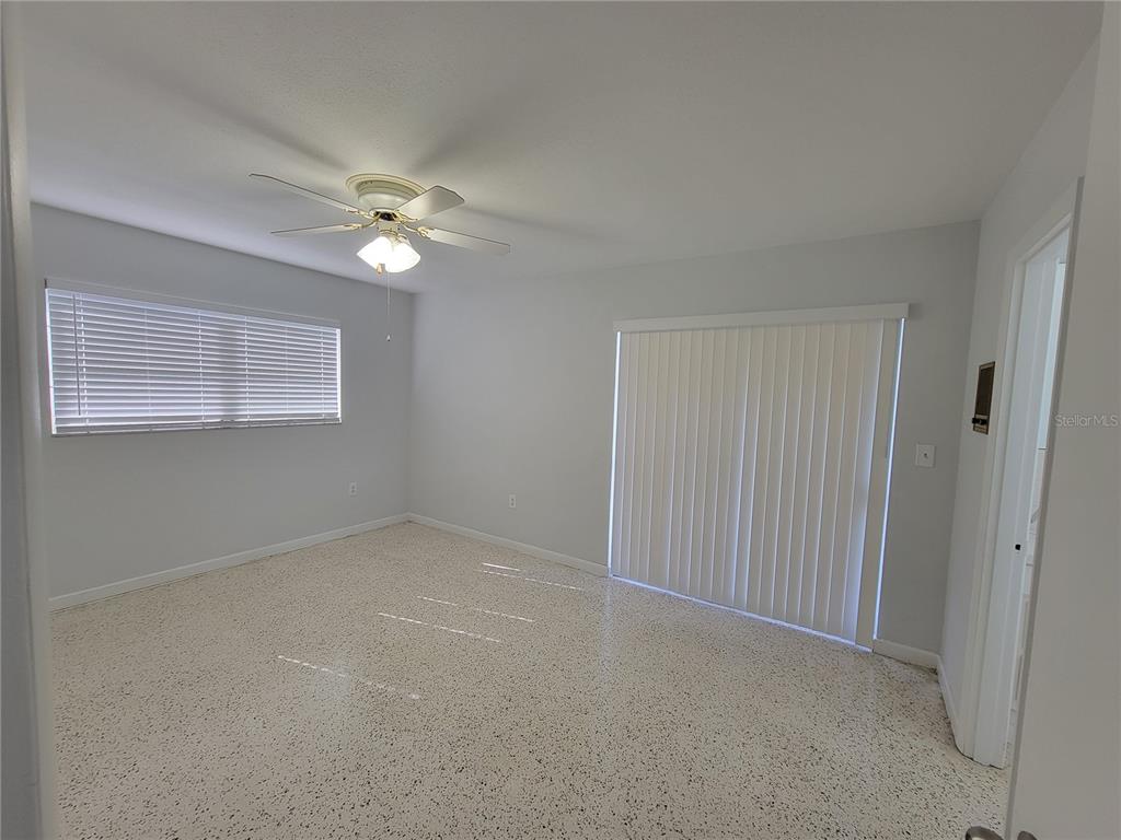 1732 Boca Raton Court Punta Gorda, FL 33950 - Photo 53 of 64 an empty room with windows and fan