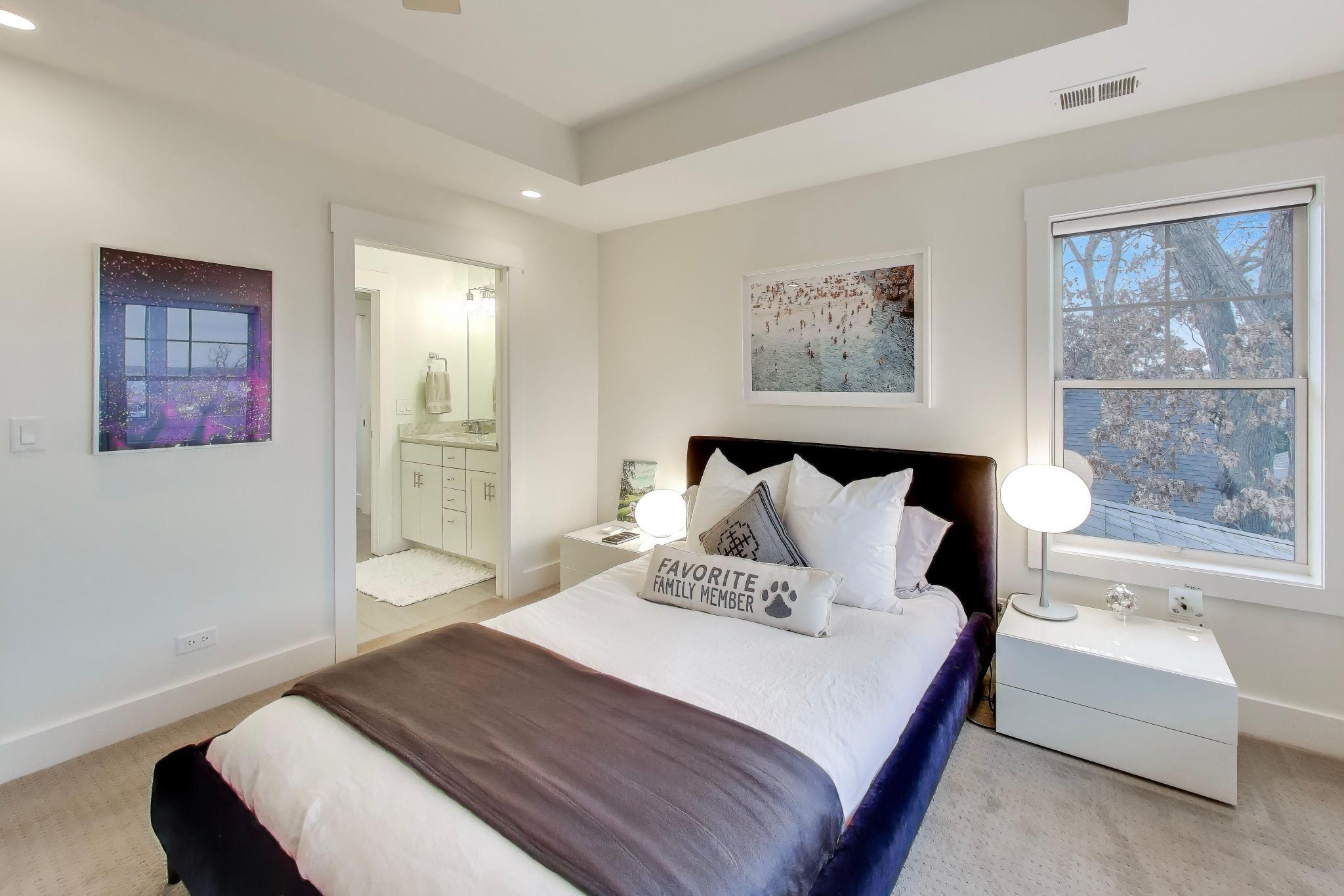 603 Agaming Road Fontana, WI 53125 - Photo 34 of 68 Well-appointed bedroom with soft natural light and convenient access to a private bath featuring modern finishes.