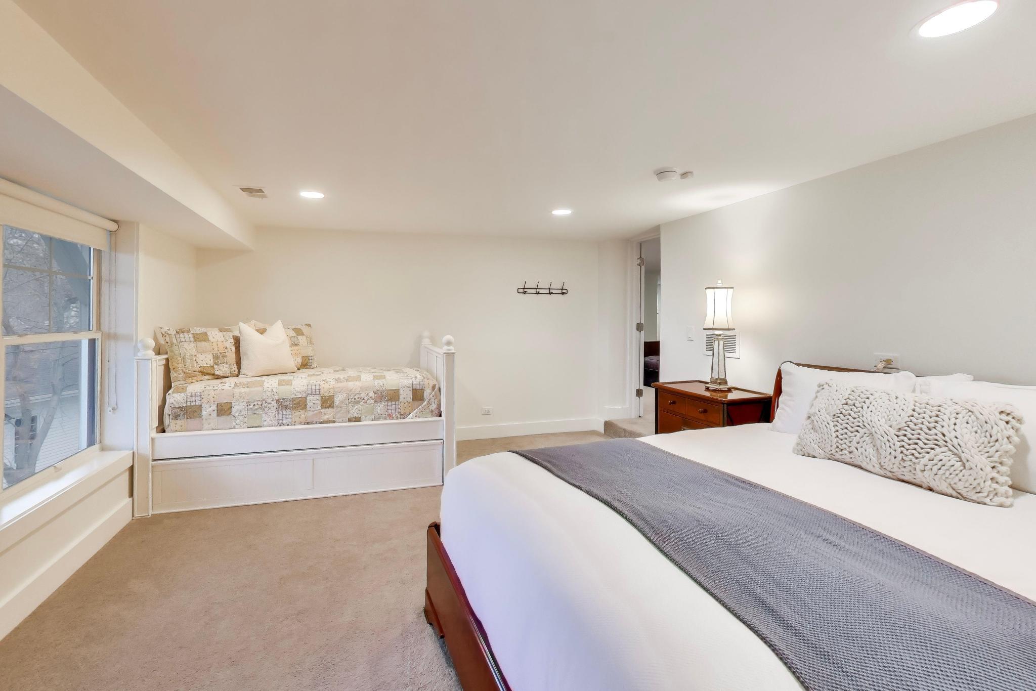 603 Agaming Road Fontana, WI 53125 - Photo 46 of 68 Generously sized bedroom with plush carpeting and flexible layout options for guests or additional living space.