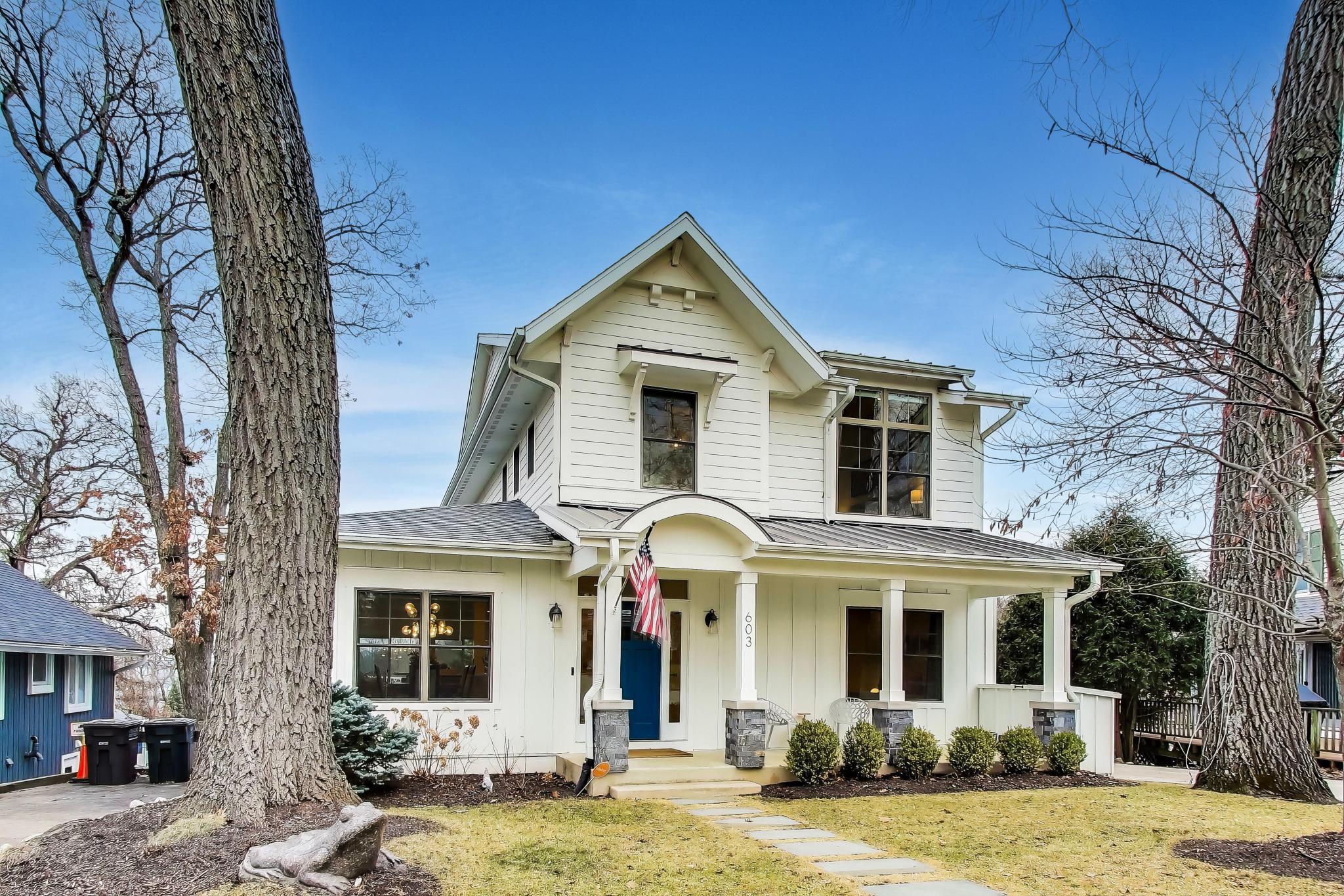 603 Agaming Road Fontana, WI 53125 - Photo 59 of 68 Attractive curb appeal highlighted by clean architectural lines, stone-accented columns, and a welcoming entry.