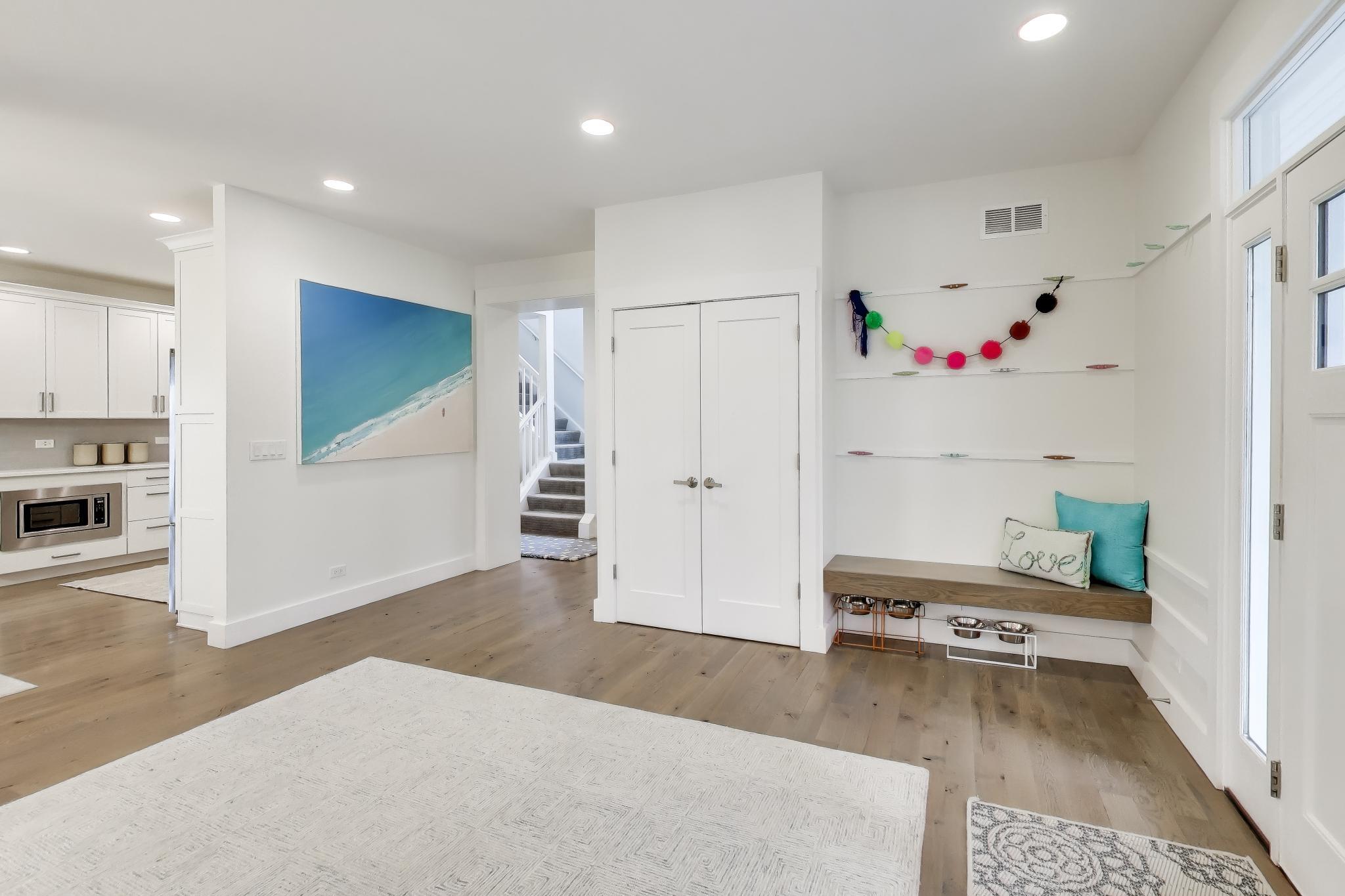 603 Agaming Road Fontana, WI 53125 - Photo 6 of 68 Functional entry with built-in bench seating, open shelving, and durable flooring for everyday convenience.