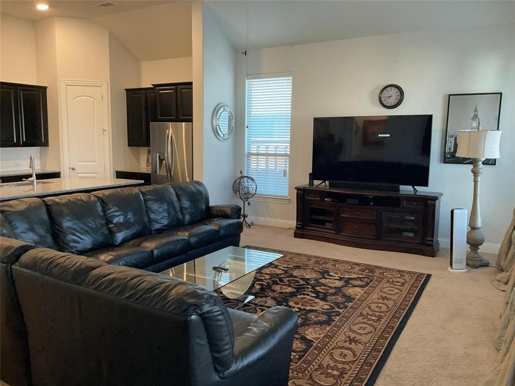 2805 Newsom Ridge Drive Mansfield, TX 76063 - Photo 13 of 33 a living room with furniture and a flat screen tv