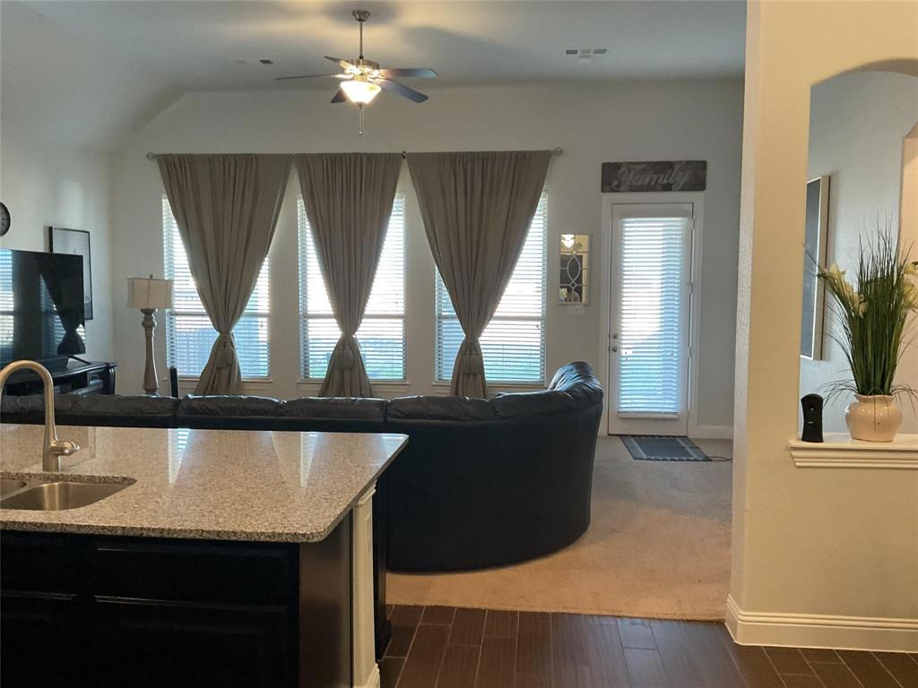 2805 Newsom Ridge Drive Mansfield, TX 76063 - Photo 15 of 33 a living room with a table chairs and couches