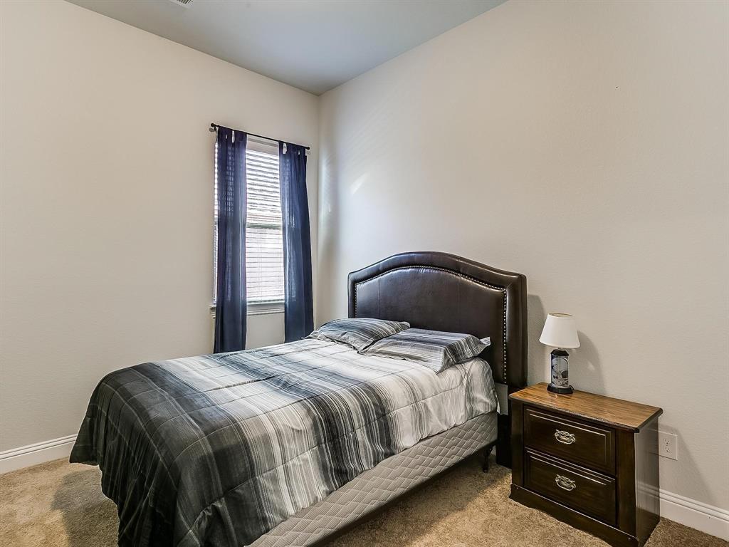 2805 Newsom Ridge Drive Mansfield, TX 76063 - Photo 19 of 33 a bedroom with a bed and window