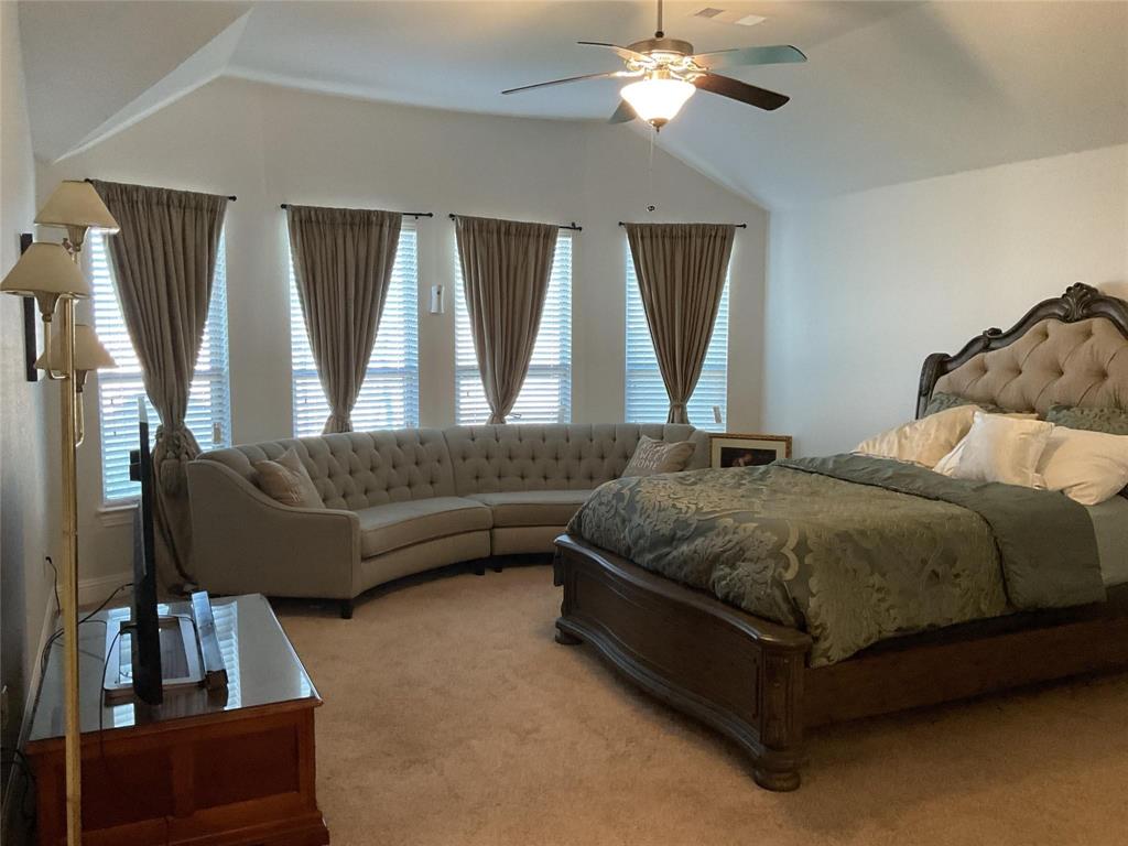 2805 Newsom Ridge Drive Mansfield, TX 76063 - Photo 22 of 33 a bedroom with a bed couch and a large window