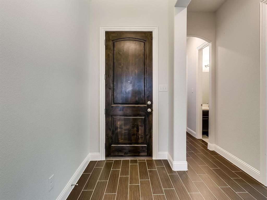 2805 Newsom Ridge Drive Mansfield, TX 76063 - Photo 3 of 33 a view of a livingroom with wooden floor and a bathroom
