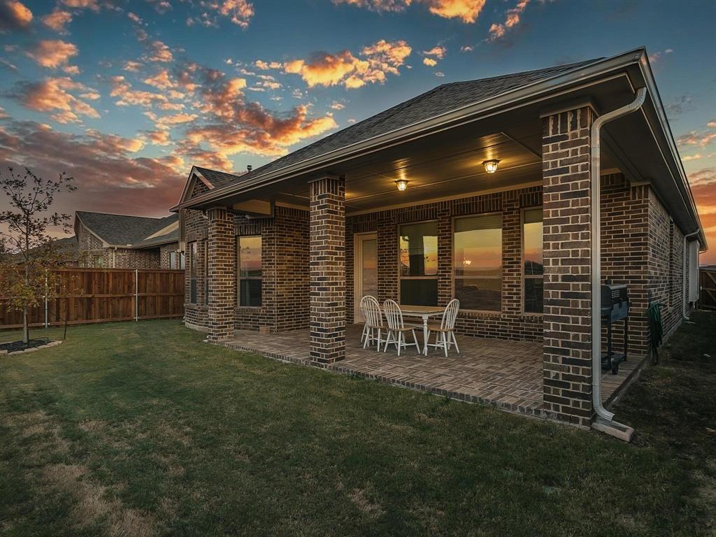 2805 Newsom Ridge Drive Mansfield, TX 76063 - Photo 32 of 33 a view of an house with backyard space and porch