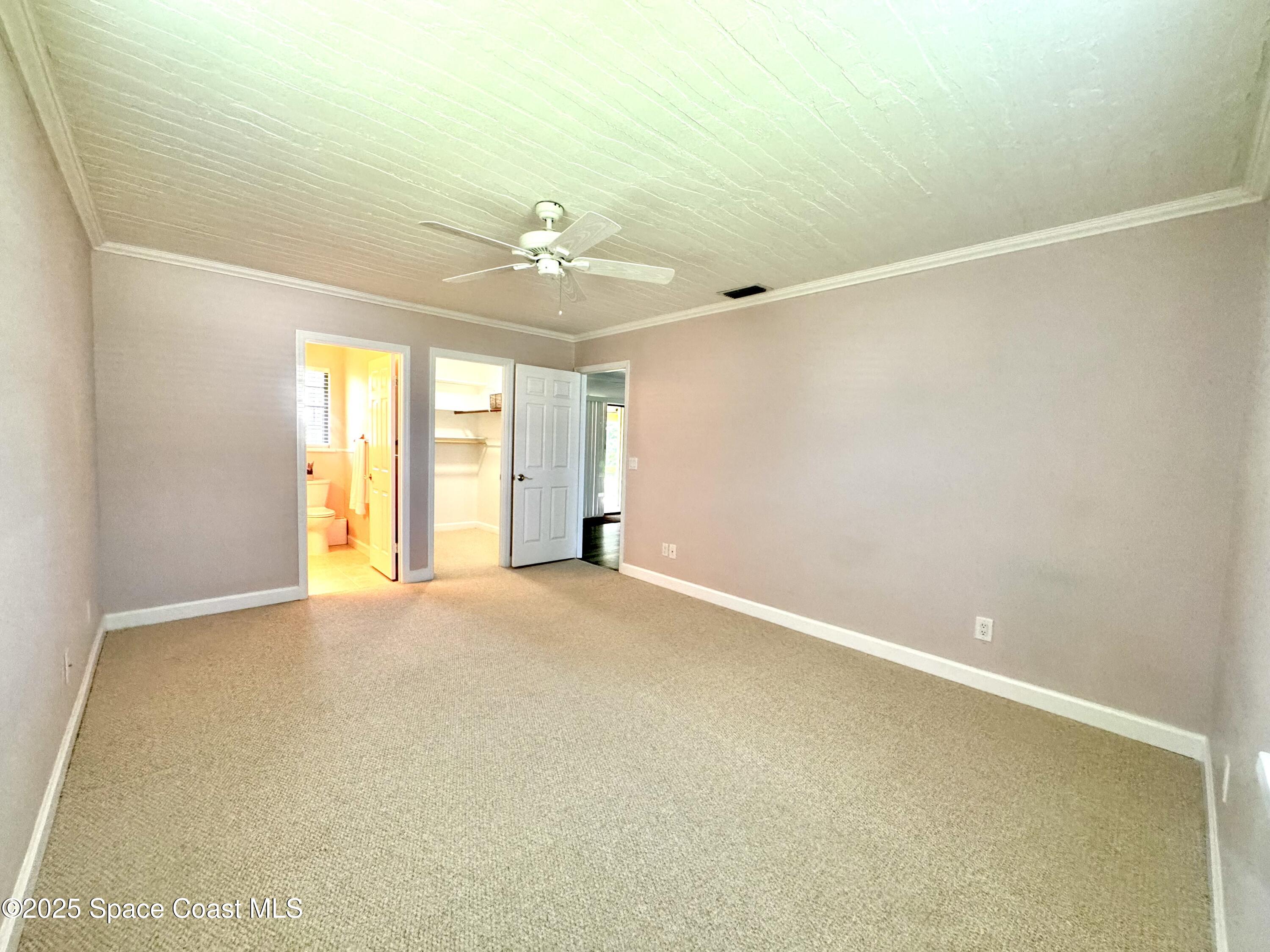 658 Ervin Street Sebastian, FL 32958 - Photo 18 of 36 a view of an empty room with a window