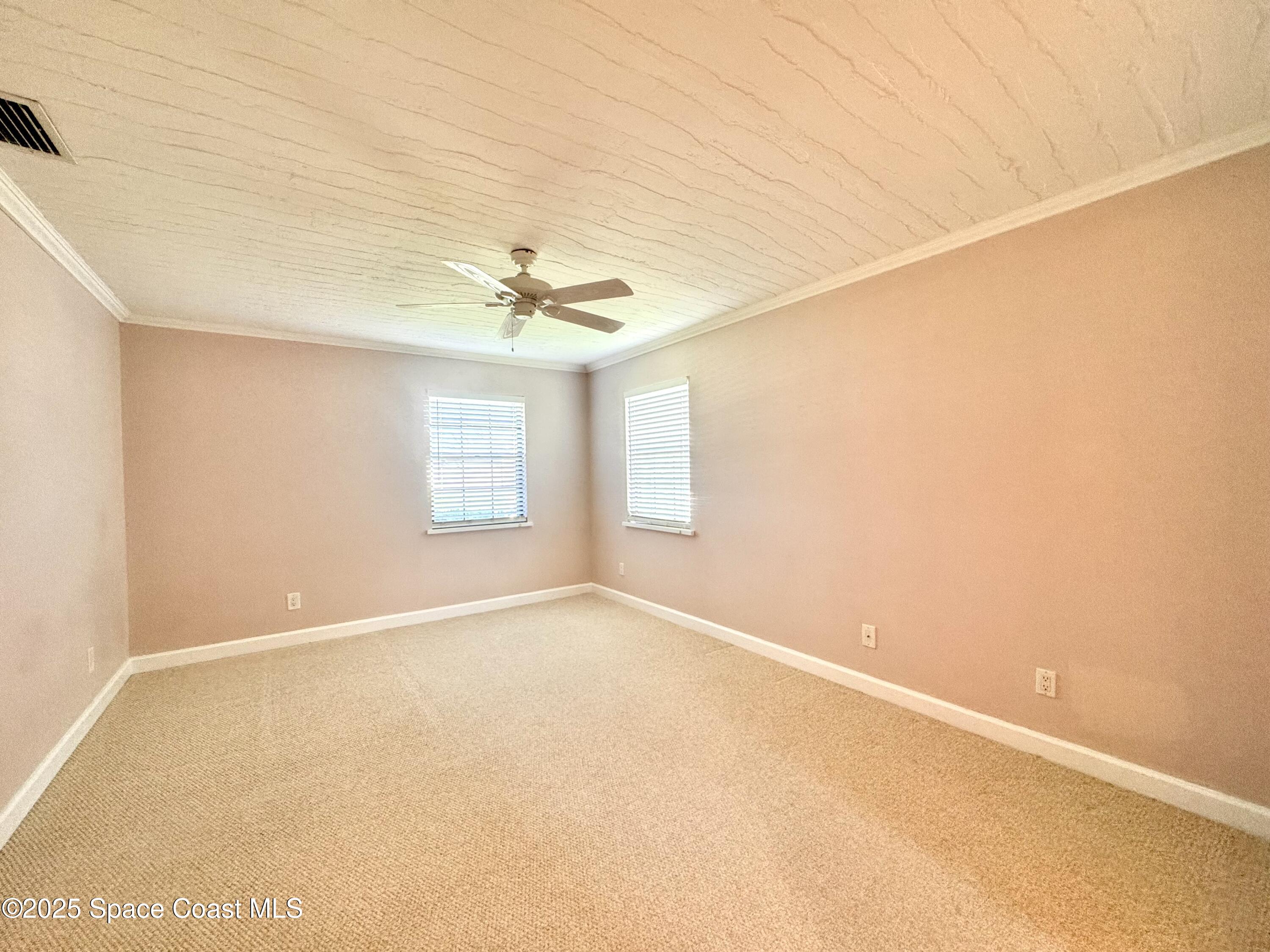 658 Ervin Street Sebastian, FL 32958 - Photo 21 of 36 a view of an empty room with a window