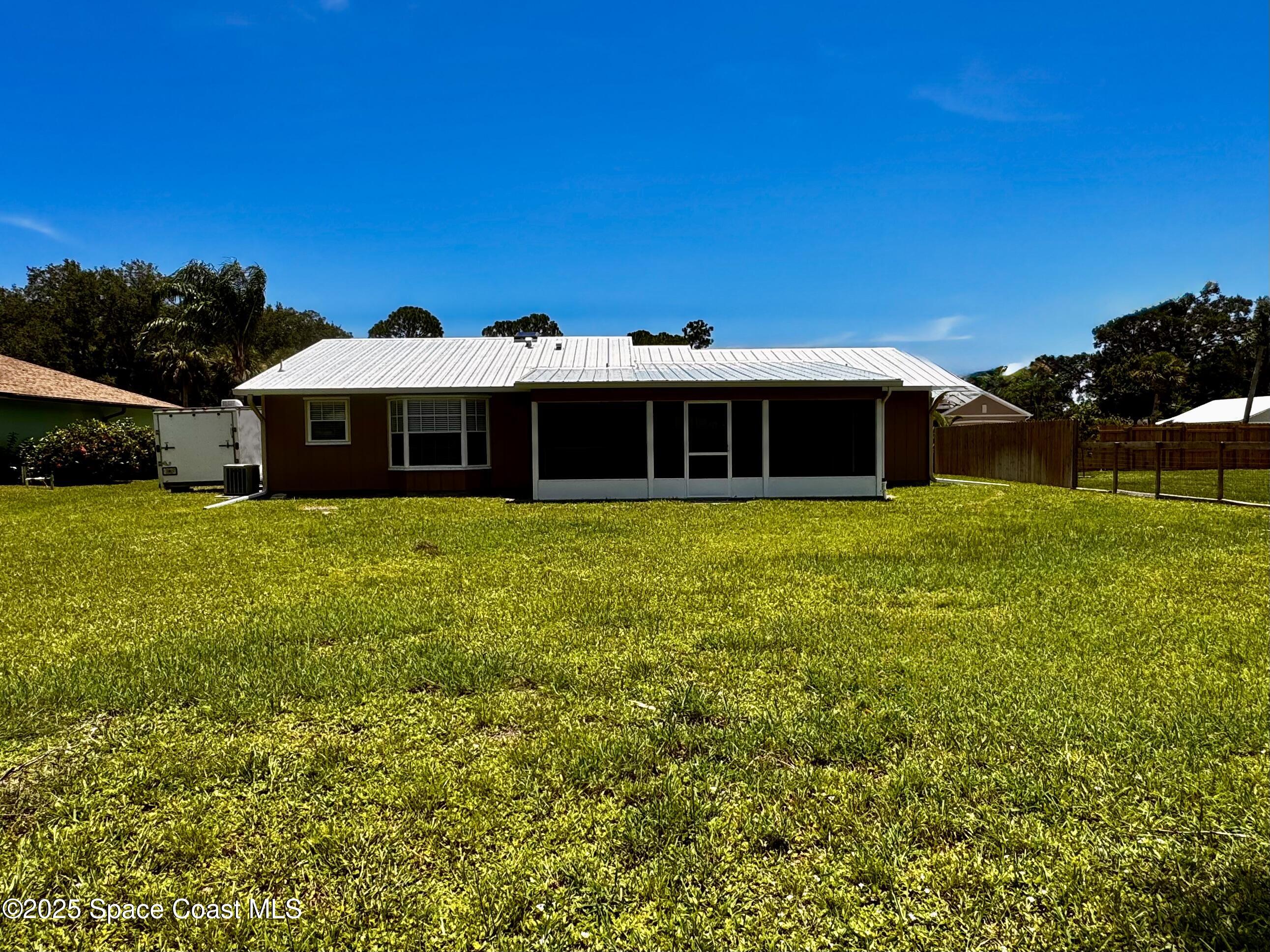 658 Ervin Street Sebastian, FL 32958 - Photo 25 of 36 a view of a house with a yard