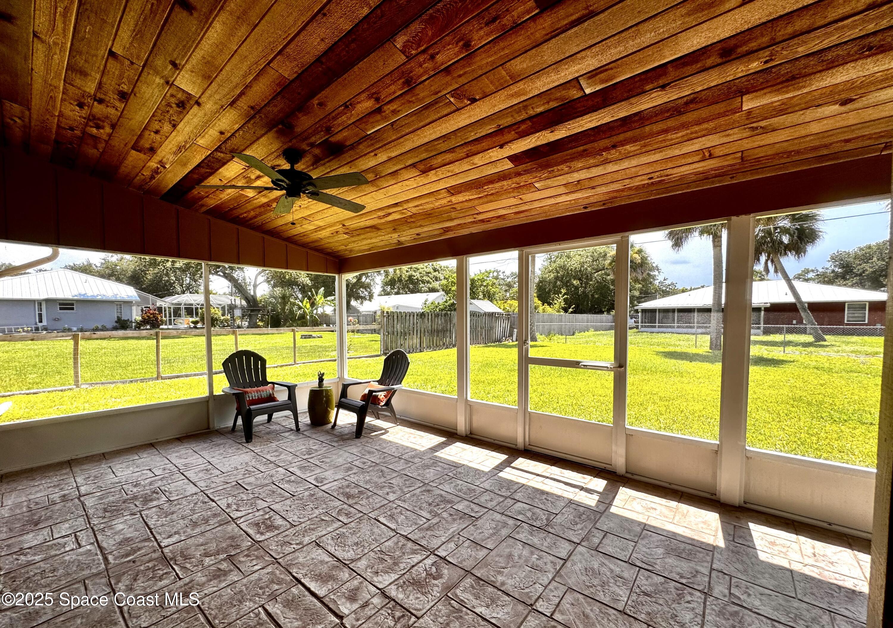 658 Ervin Street Sebastian, FL 32958 - Photo 26 of 36 a view of a swimming pool with a table and chairs in the patio