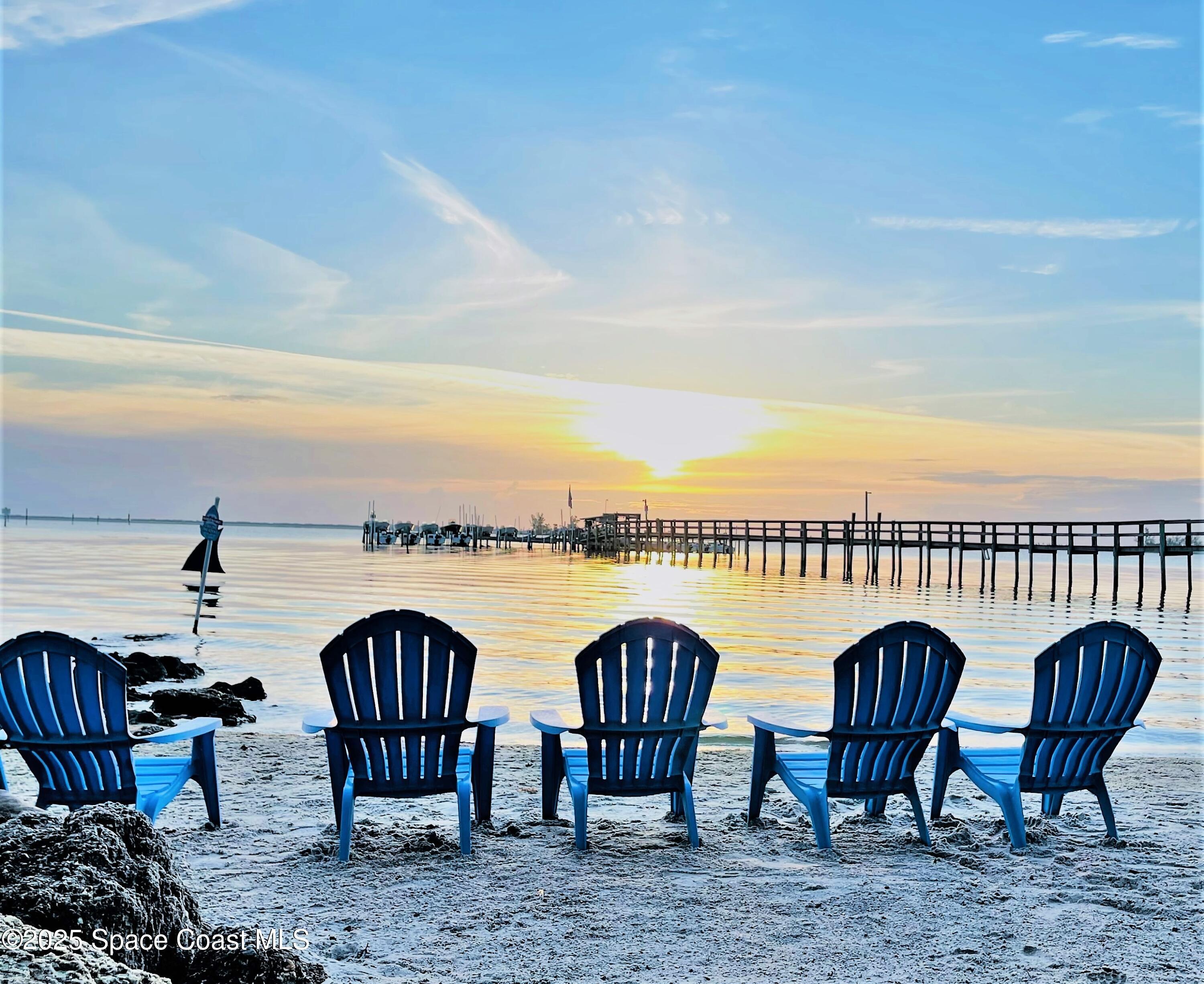 658 Ervin Street Sebastian, FL 32958 - Photo 35 of 36 a view of a balcony with chairs and a table