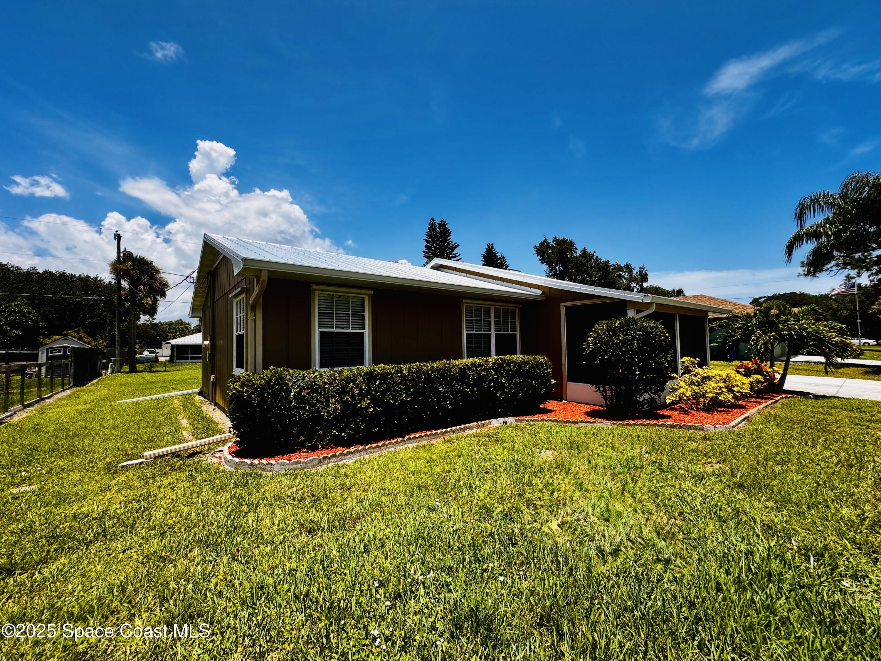 658 Ervin Street Sebastian, FL 32958 - Photo 5 of 36 a view of a house with a patio