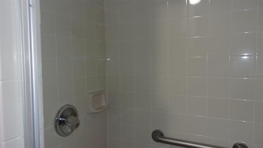 10015 Southwest 90th Court Ocala, FL 34481 - Photo 23 of 48 a bathroom with a shower