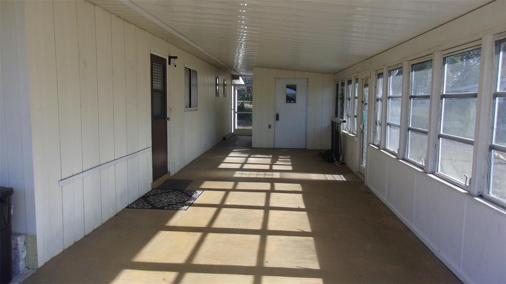 10015 Southwest 90th Court Ocala, FL 34481 - Photo 27 of 48 a view of a hallway with windows