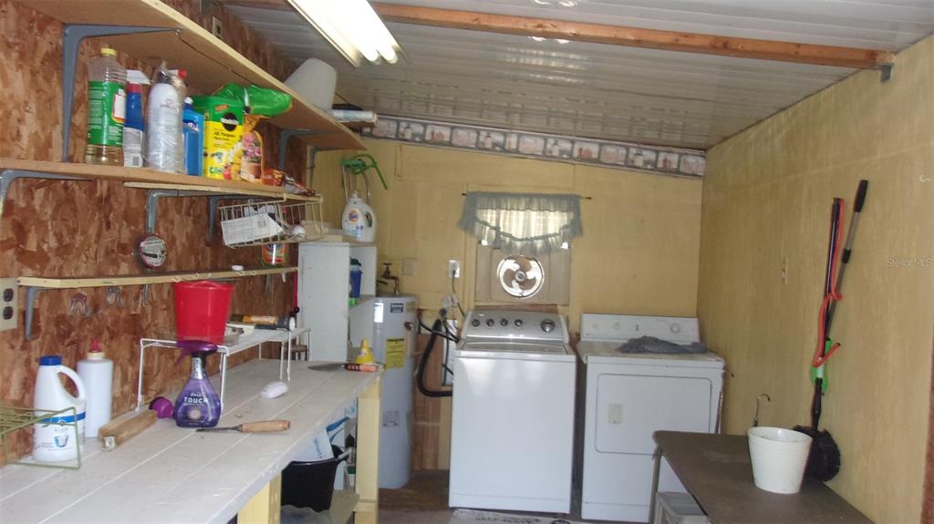 10015 Southwest 90th Court Ocala, FL 34481 - Photo 28 of 48 a storage room with washer and dryer