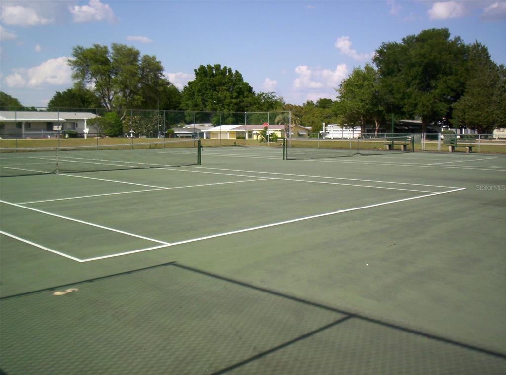 10015 Southwest 90th Court Ocala, FL 34481 - Photo 40 of 48 a view of a tennis court
