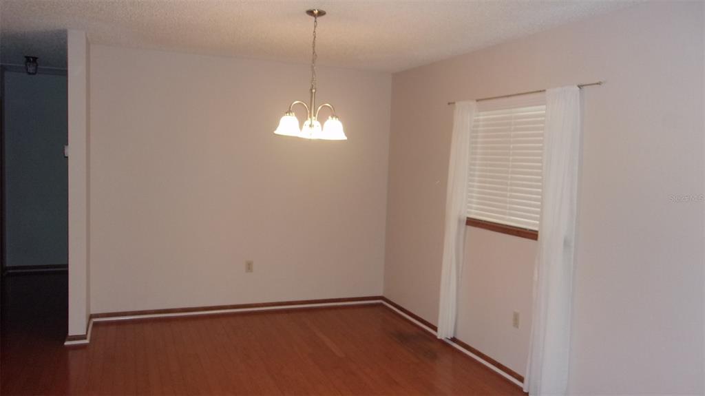 10015 Southwest 90th Court Ocala, FL 34481 - Photo 5 of 48 a view of an empty room with a window
