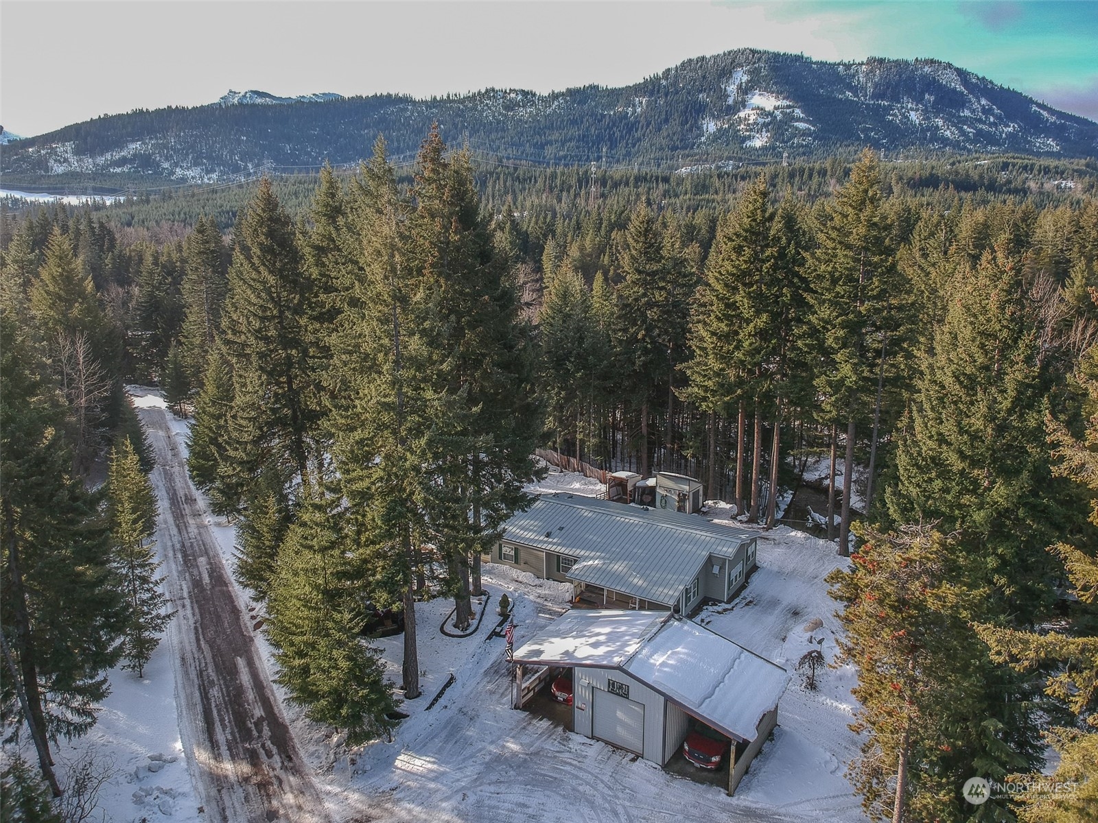 a view of a house with a mountain yard