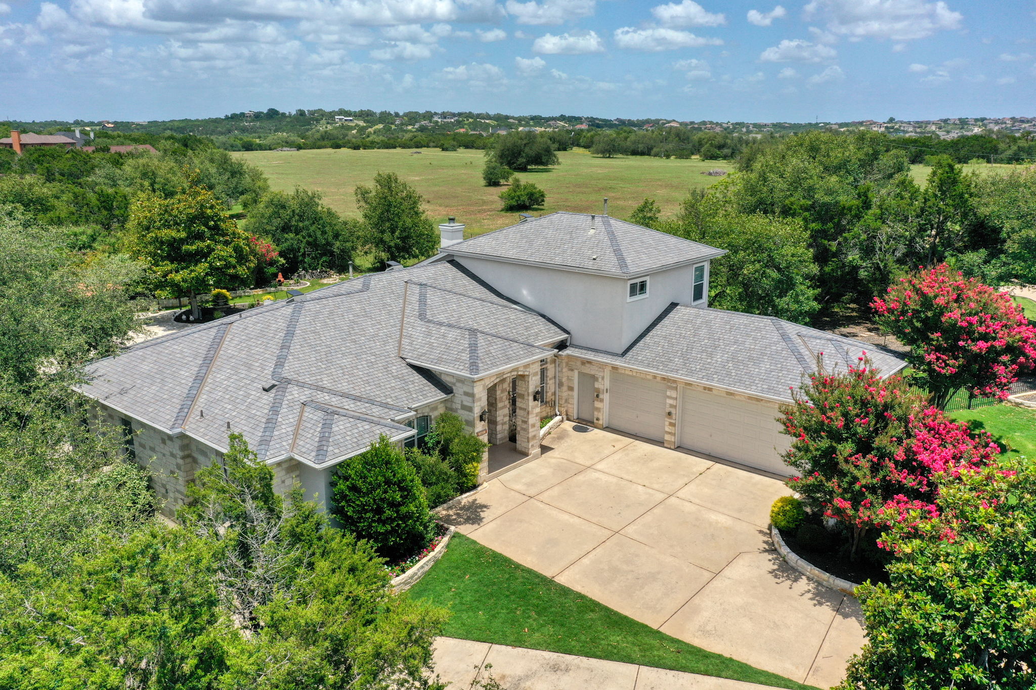 1601 Coronado Leander, TX 78641 - Photo 4 of 37 an aerial view of a house with a garden and lake view