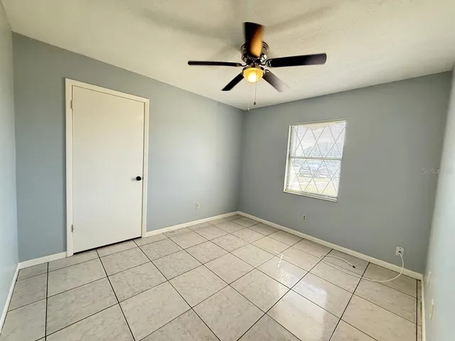 a view of an empty room and window
