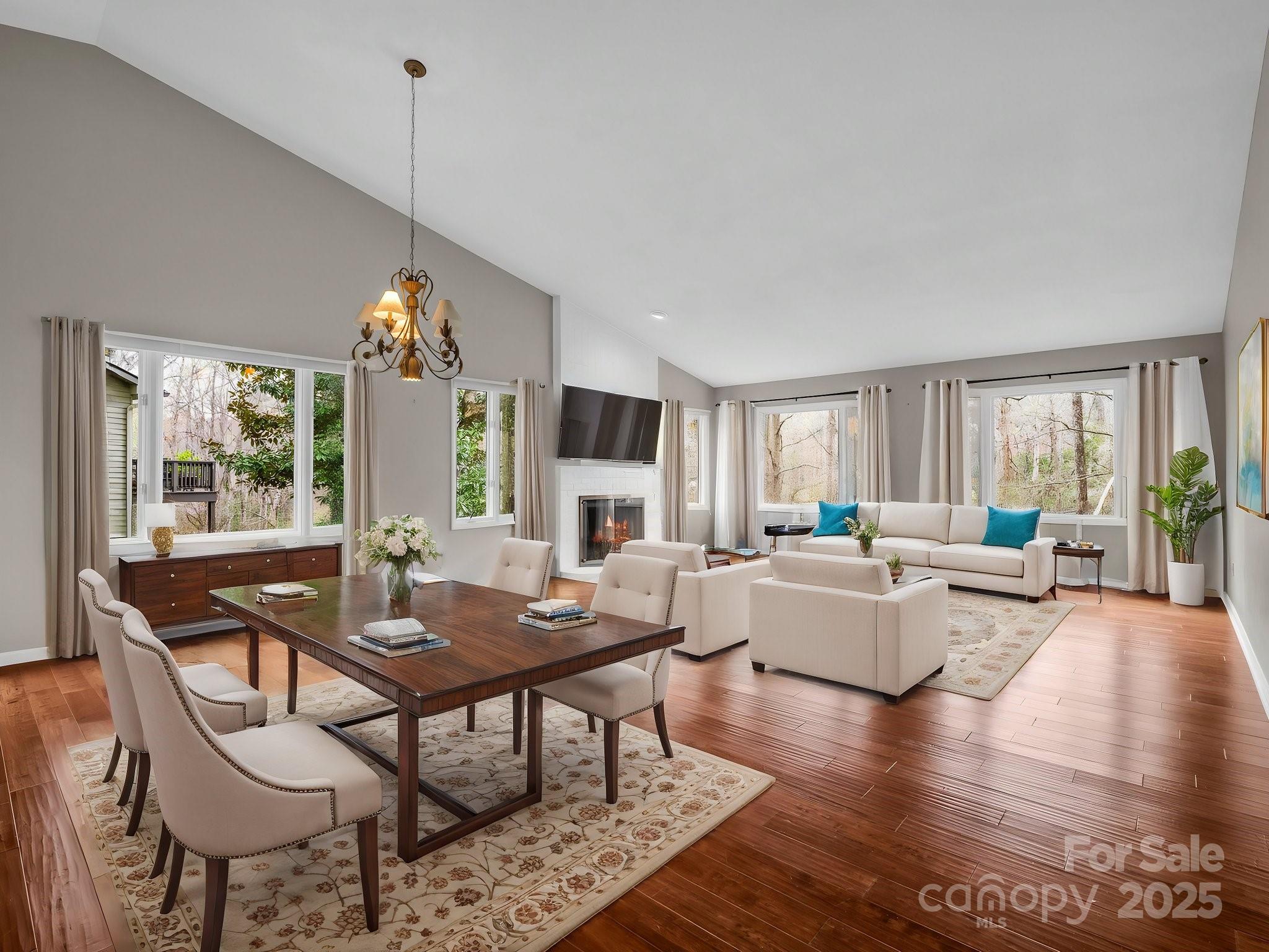 a living room with fireplace furniture and a wooden floor