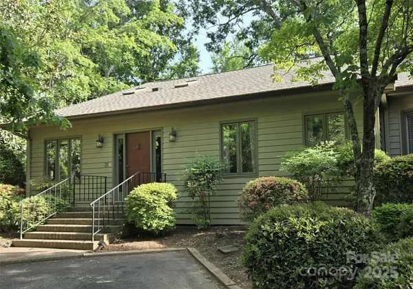 front view of a house with a small yard