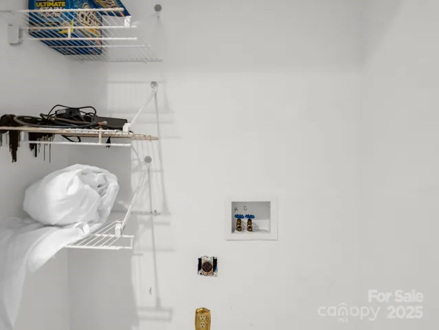 a close view of a utility room with dryer and washer