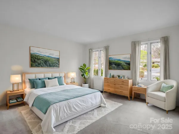 a bedroom with a bed and a couch