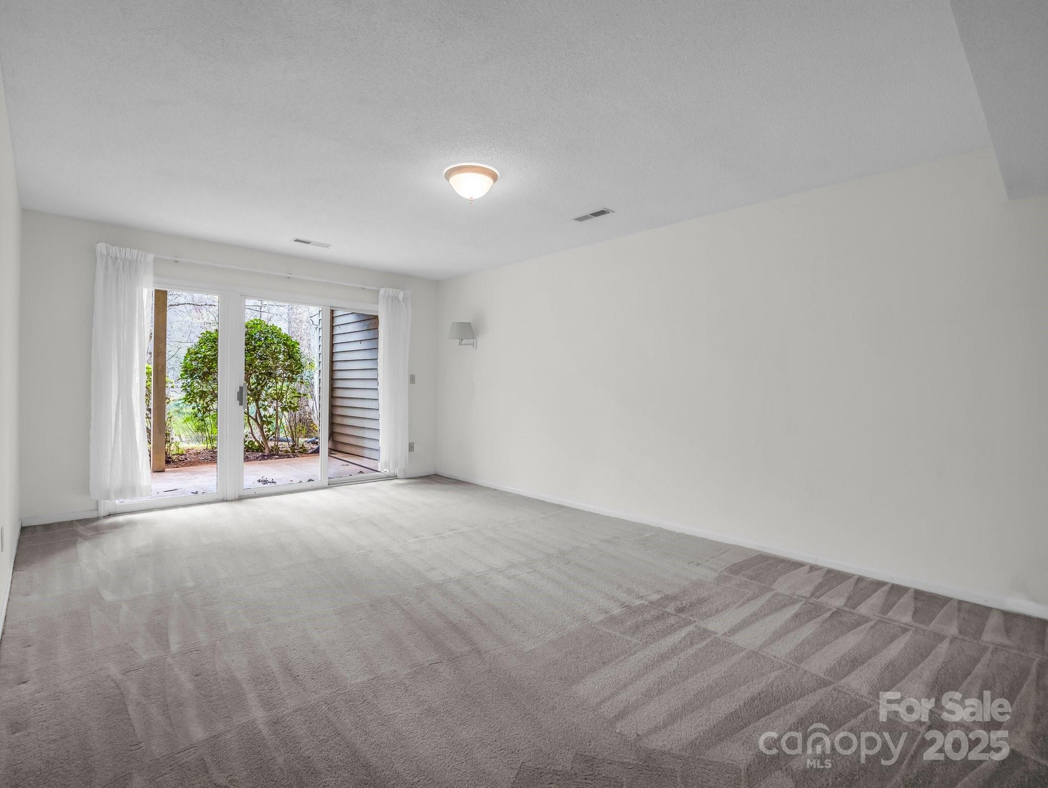 31 Hunting Country Trail Tryon, NC 28782 - Photo 30 of 40 wooden floor in an empty room with a window