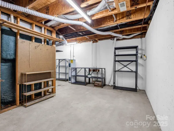 a view of an empty room with wooden roof