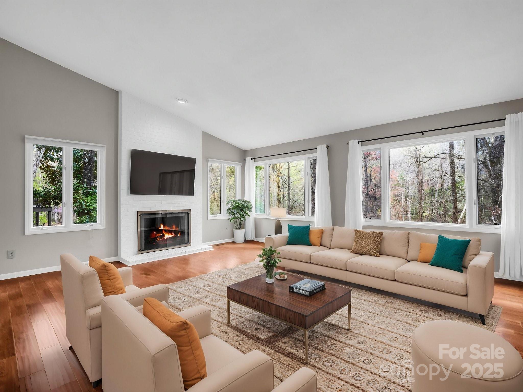 31 Hunting Country Trail Tryon, NC 28782 - Photo 7 of 40 a living room with furniture a fireplace and a large window
