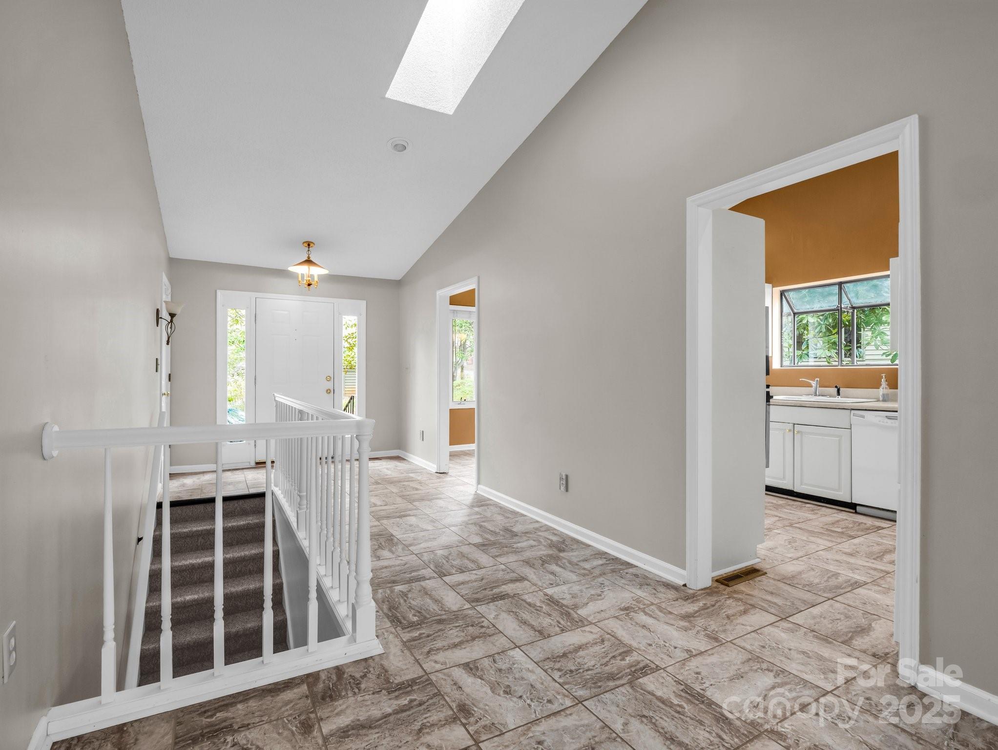 31 Hunting Country Trail Tryon, NC 28782 - Photo 9 of 40 a view of a hallway with wooden floor and a kitchen