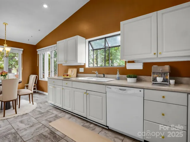 a kitchen that has a sink and a window in it