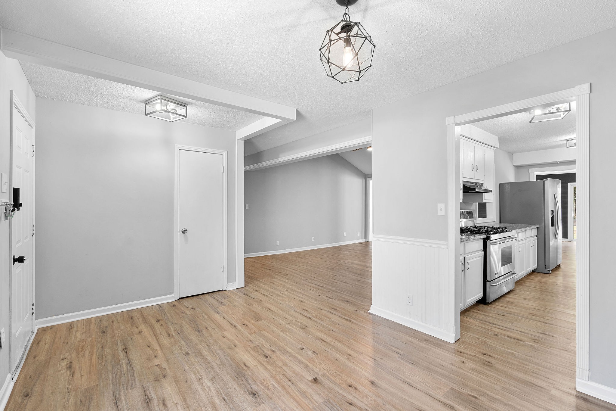 440 Cunningham Lane Clarksville, TN 37042 - Photo 11 of 42 a view of a kitchen with a wooden floor and a refrigerator