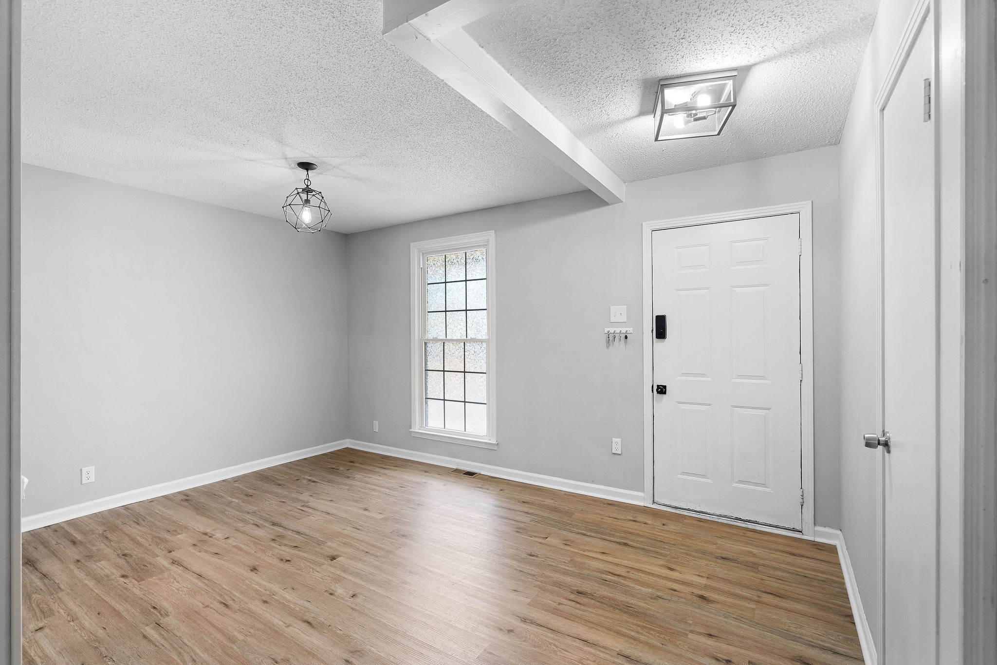 440 Cunningham Lane Clarksville, TN 37042 - Photo 12 of 42 wooden floor in an empty room with a window