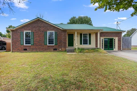 a front view of a house with yard