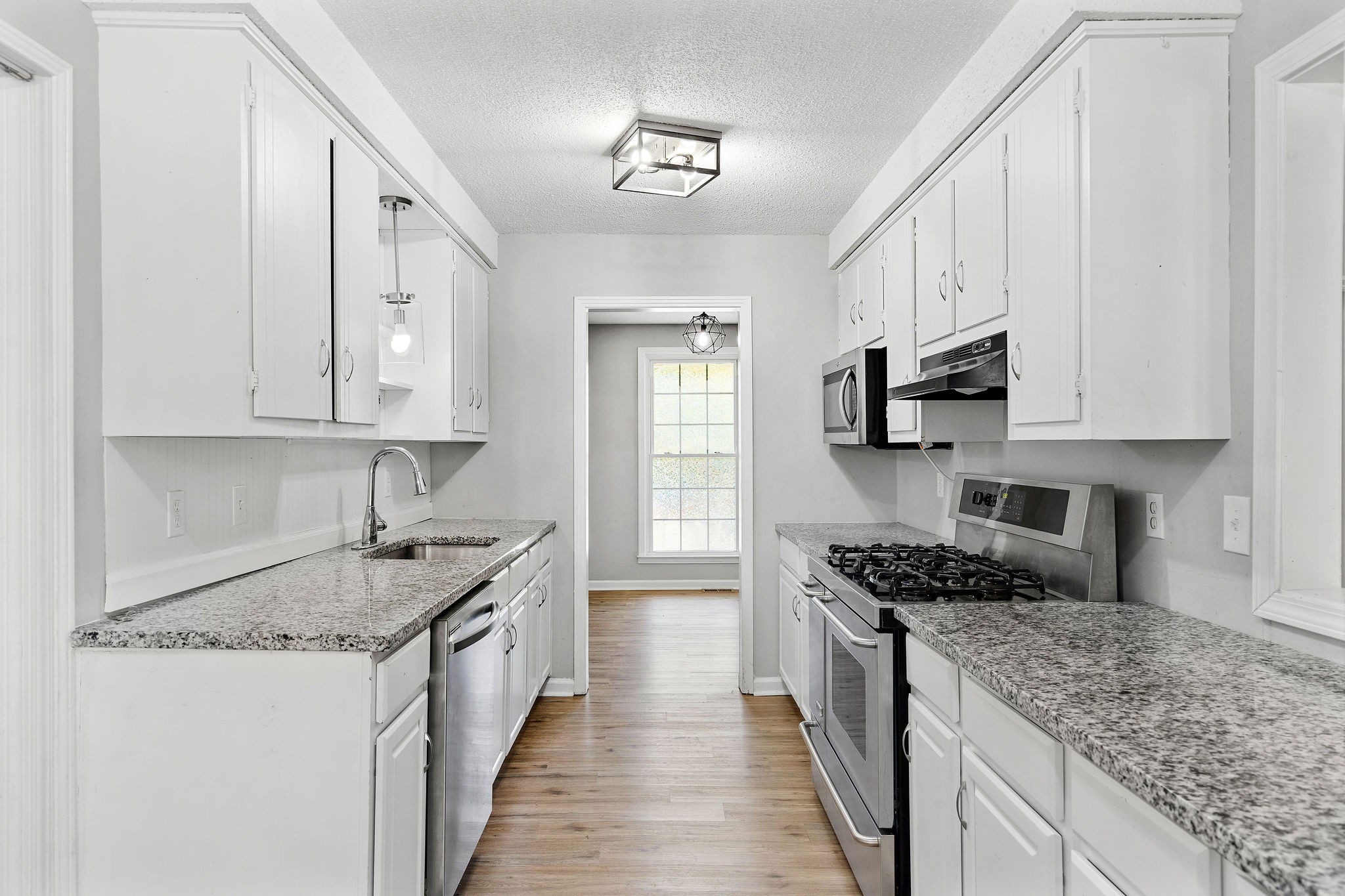 440 Cunningham Lane Clarksville, TN 37042 - Photo 9 of 42 a kitchen with stainless steel appliances granite countertop a sink stove and cabinets