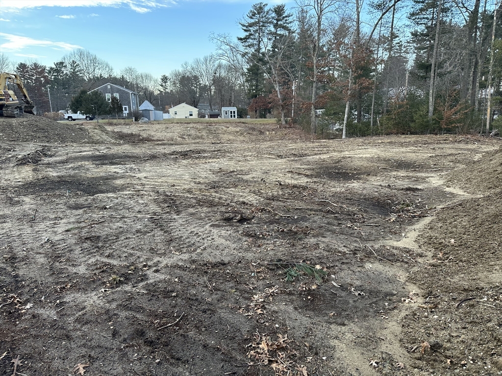 91 Snow Street Hanson, MA 02341 - Photo 5 of 7 a view of dirt yard with trees