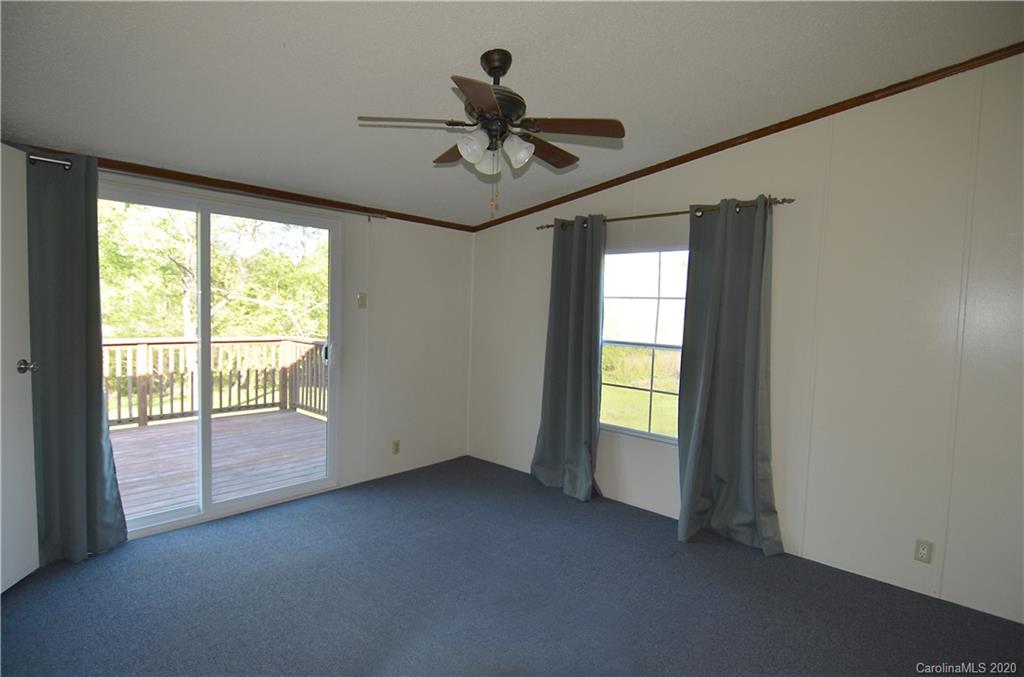 358 Toney Road Marion, NC 28752 - Photo 11 of 21 a view of room with window and ceiling fan