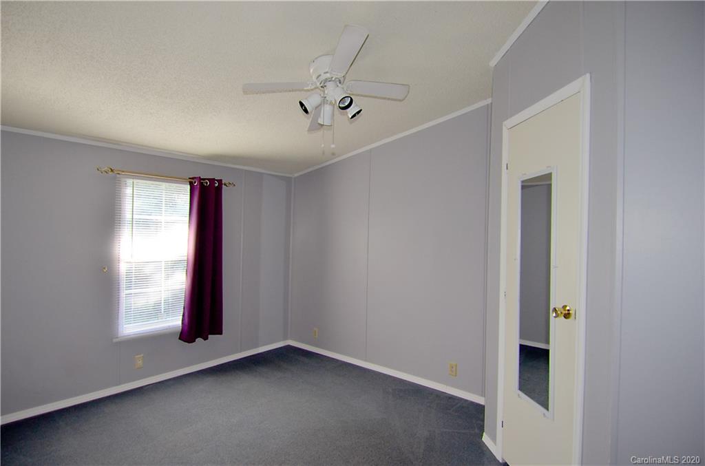 358 Toney Road Marion, NC 28752 - Photo 14 of 21 a view of an empty room with a window