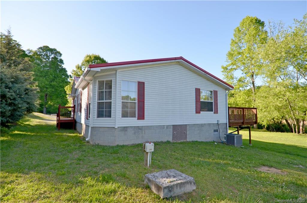 358 Toney Road Marion, NC 28752 - Photo 3 of 21 a view of a house with a backyard