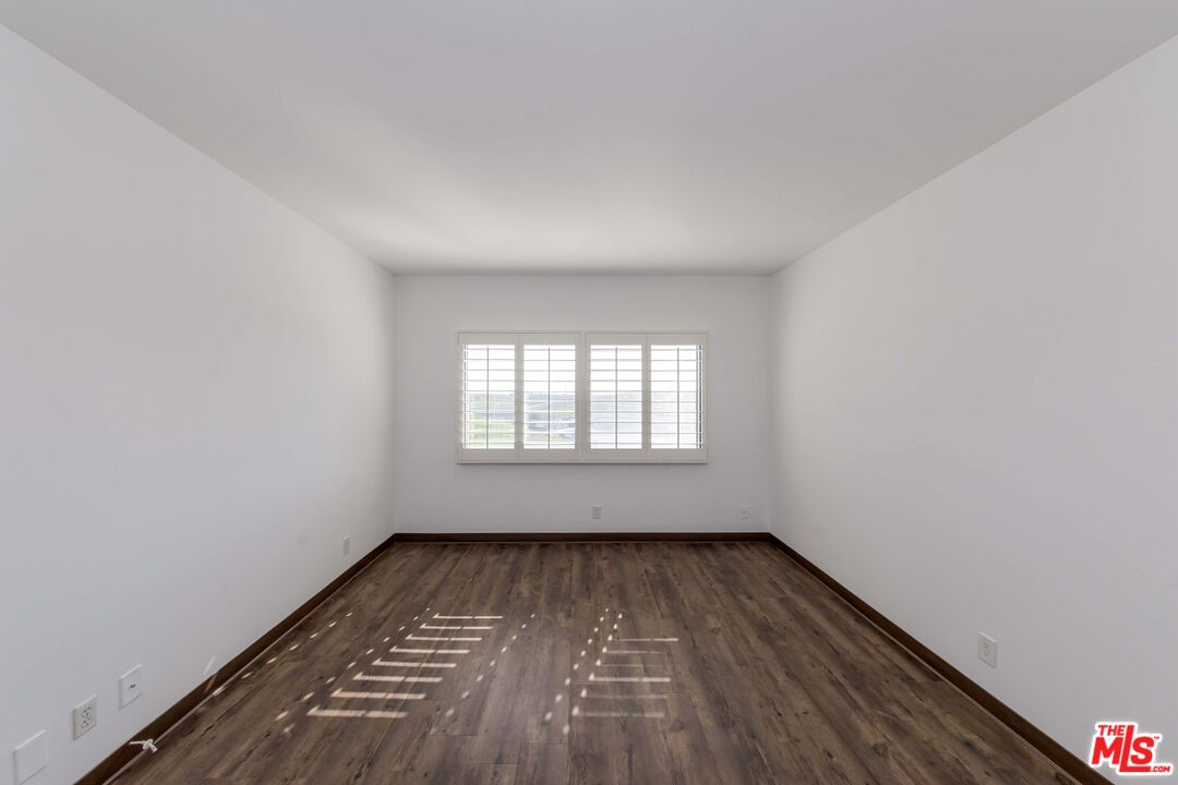 8180 Manitoba Street, Unit 248 Playa del Rey, CA 90293 - Photo 13 of 40 wooden floor in an empty room with a window