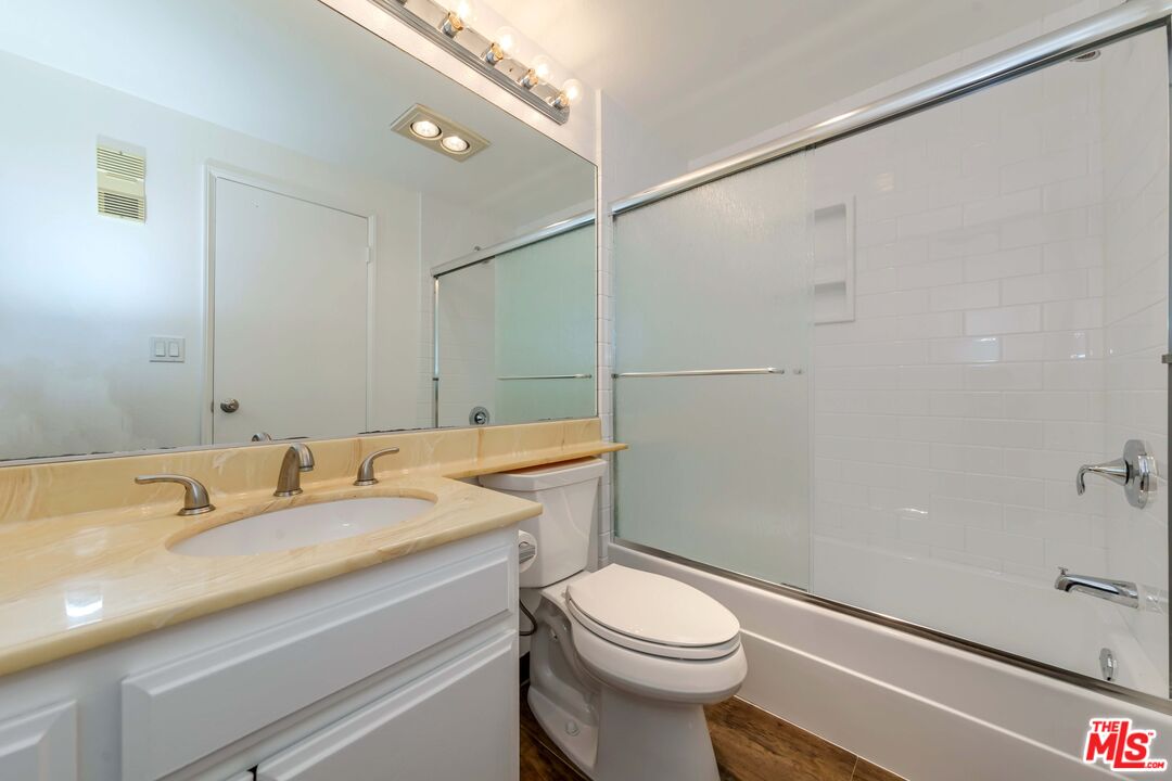 8180 Manitoba Street, Unit 248 Playa del Rey, CA 90293 - Photo 24 of 40 a bathroom with a granite countertop sink toilet and shower