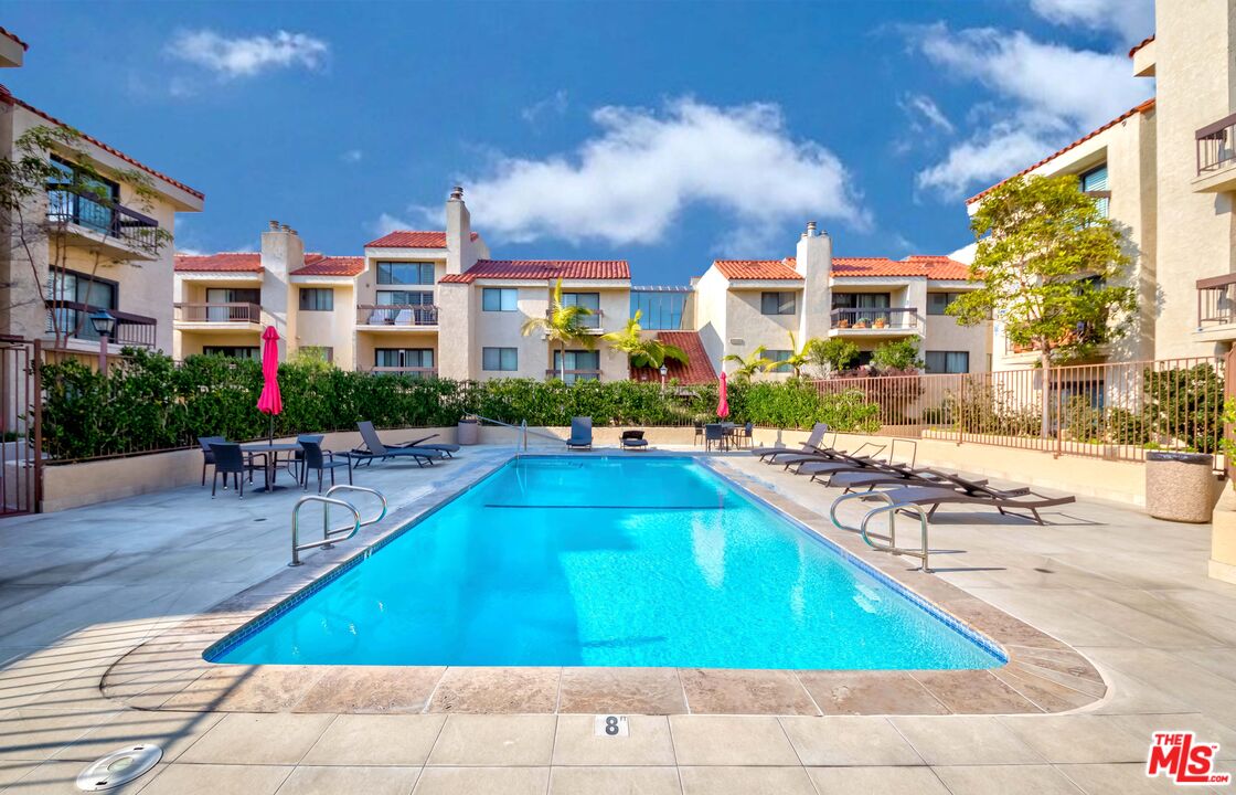 8180 Manitoba Street, Unit 248 Playa del Rey, CA 90293 - Photo 25 of 40 a swimming pool with outdoor seating and yard